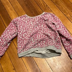 im selling th is pink Cheetah print shirt the size is 10/12 in kids
